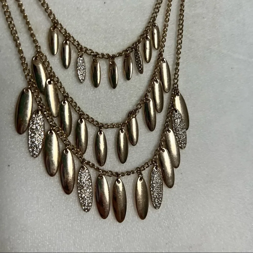 Triple strand gold and rhinestone studded petal necklace